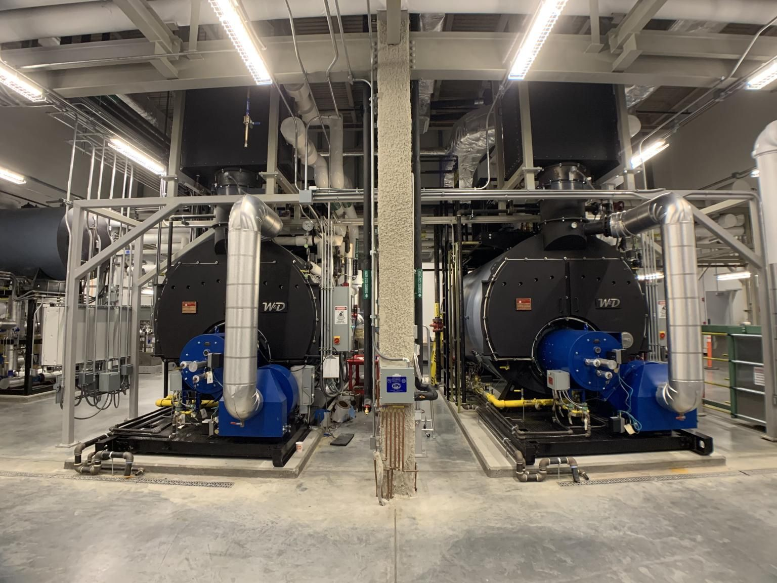 HeatSponge economizers installed above two industrial steam boilers