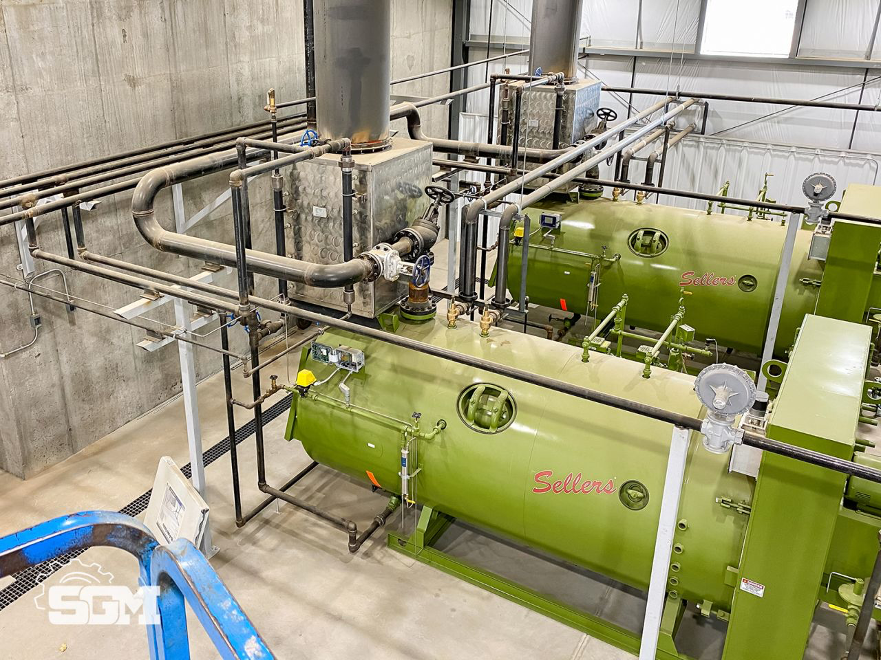 SHORTY economizers installed above two green Sellers steam boilers