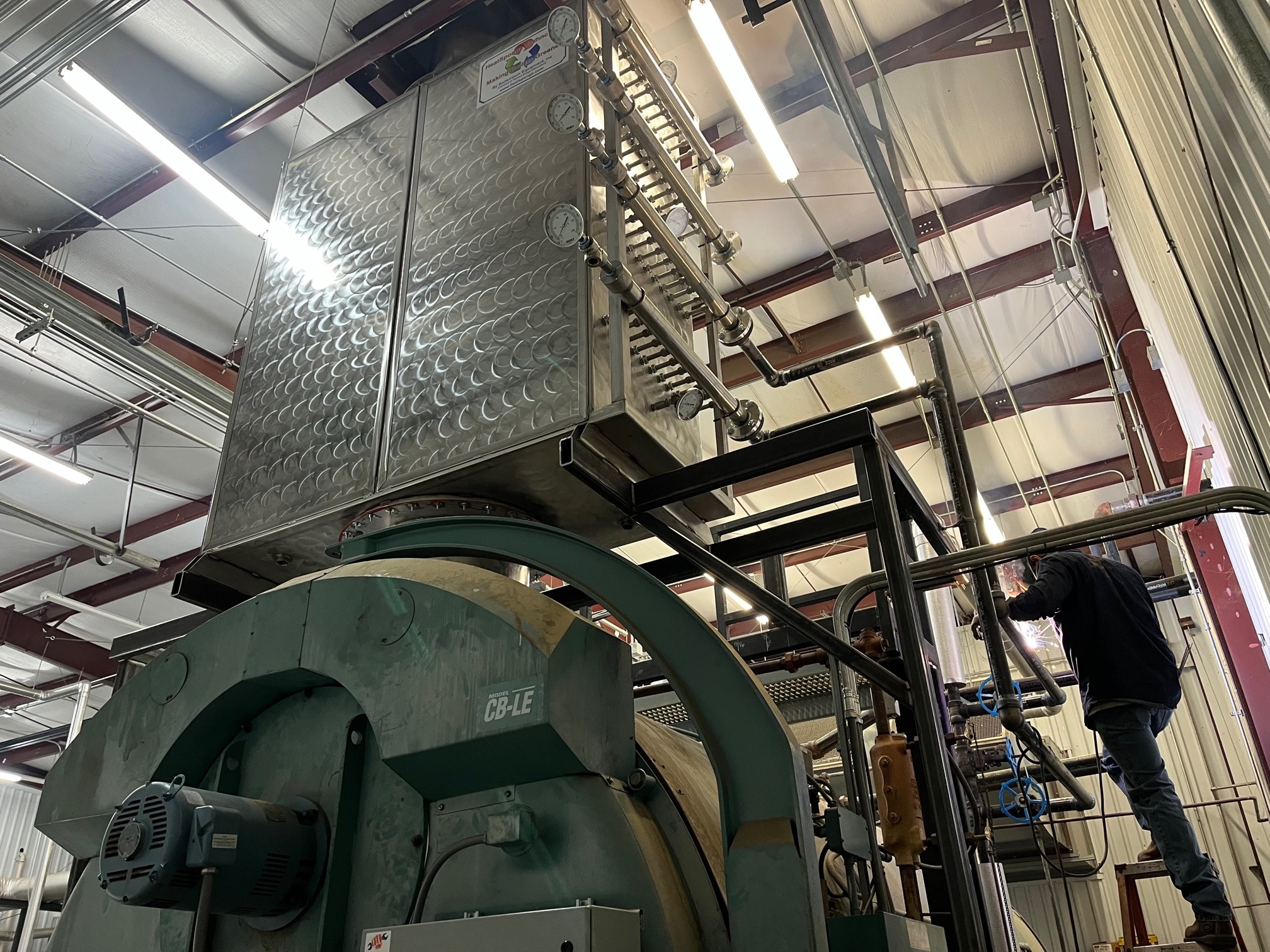 HeatSponge economizer mounted above an industrial boiler during installation